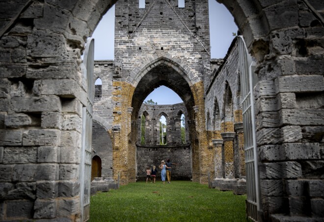 Weathered grey stone and towering archways make for a fascinating backdrop at the Unfinished Church in St. George’s.